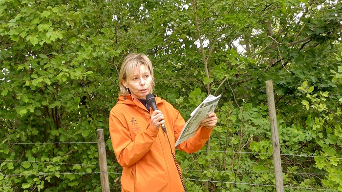 Iryna Matsiakh with deciduous trees in background. Photo.