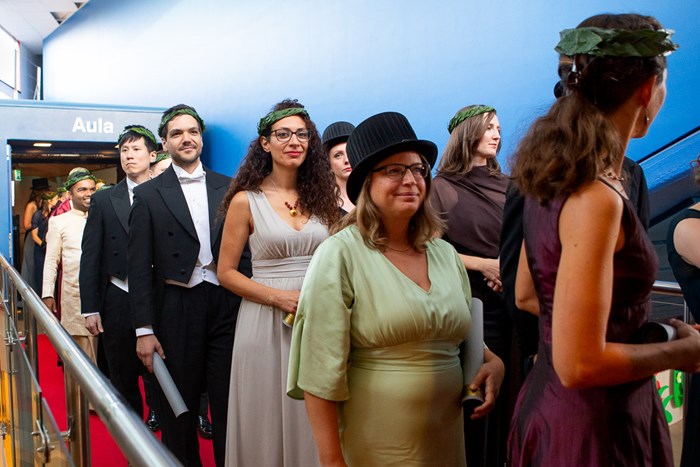 Cheerful new doctors during the departure of the procession