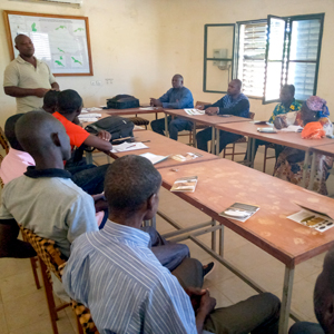 People sitting at a table indoors, photo.