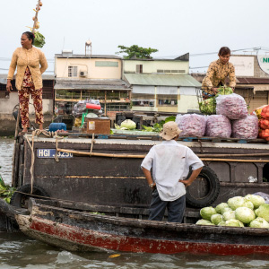 Persons around a long-tail boat, photo.