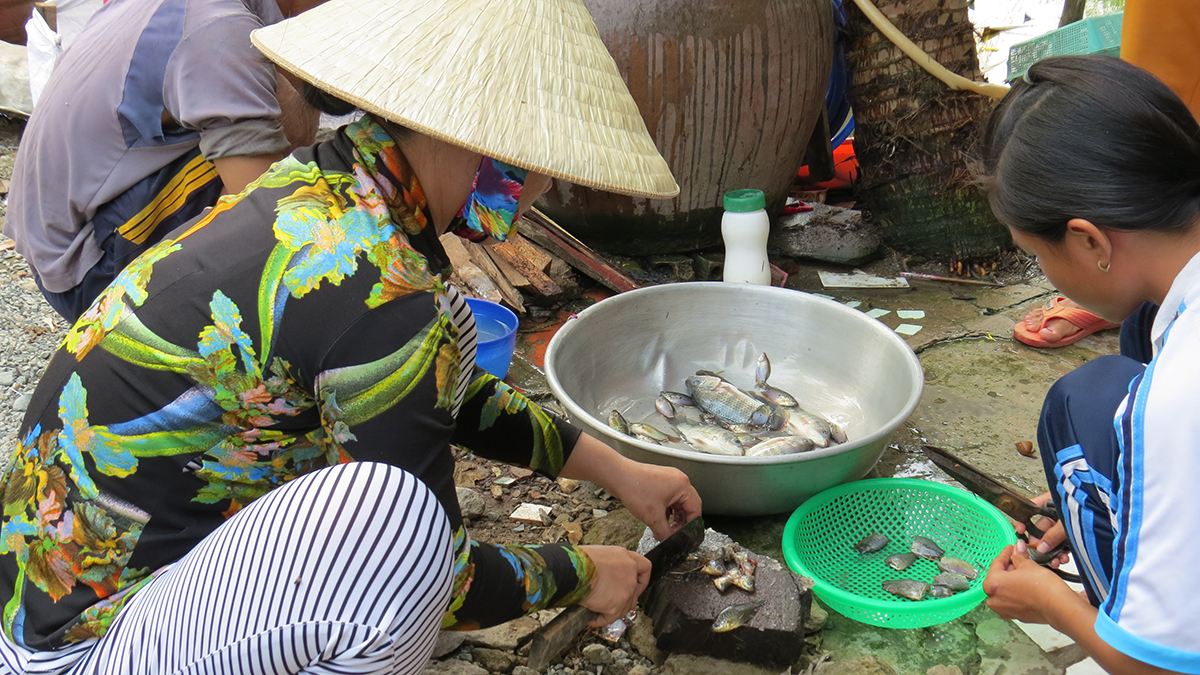 Family in Vietnam preparing food