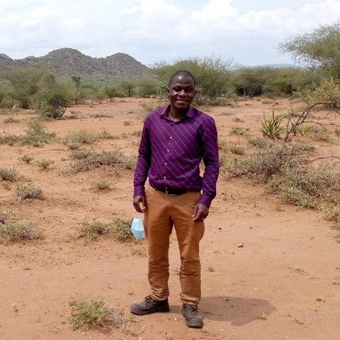 Photo of Ugandan man in a dry area.