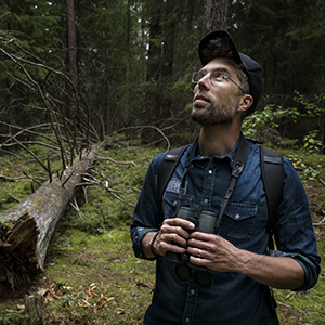 Portrait of Marcus Hedblom in a forest.