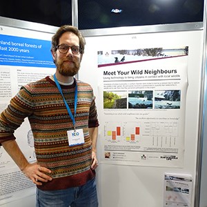Tim Hofmeester in front of his poster at the conference.