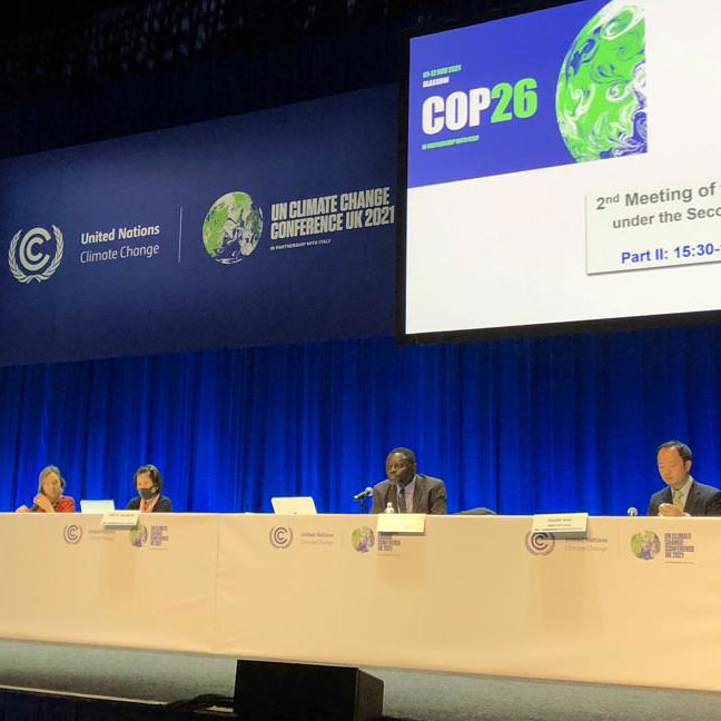 Delegater i panel på COP26