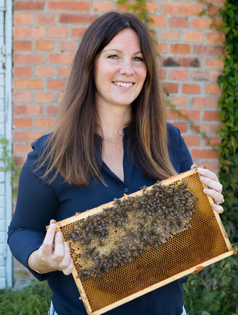 Women with a hive frame