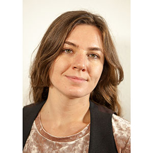 Photo of Vera Sadovska, woman with dark, long hair.