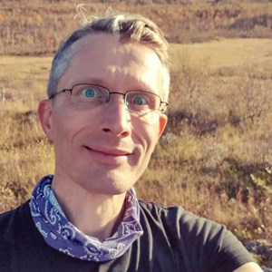 Portrait photo of a man outdoors. Photo.