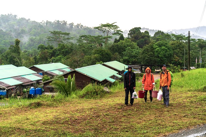 Arvid Lindh, Maja Sundqvist and Niles Hasselquist on route to establishing their climate change experiment. The village depicted is Luasong. 