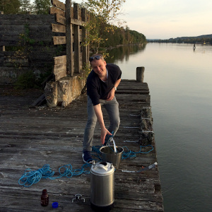 A person close to water. Field equipment. Photo.