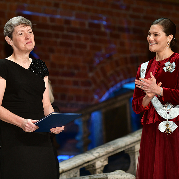 Two women in elegant dresses.