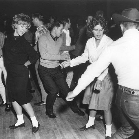 Happy youth dancing, vintage black and white photograph.