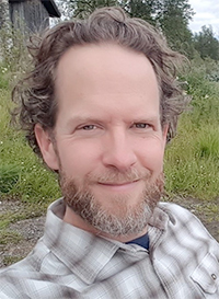 Portrait photo of a man outdoors. Photo.