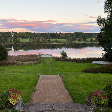 View of garden and watercourse. Photo.