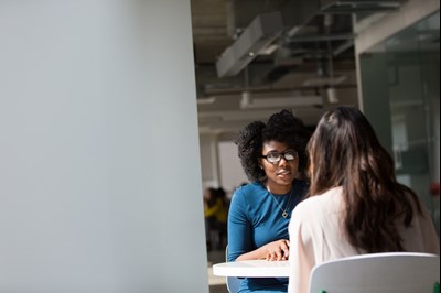 Two people talking, photo