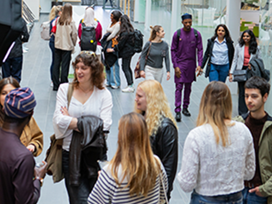 students in a corridor on campus
