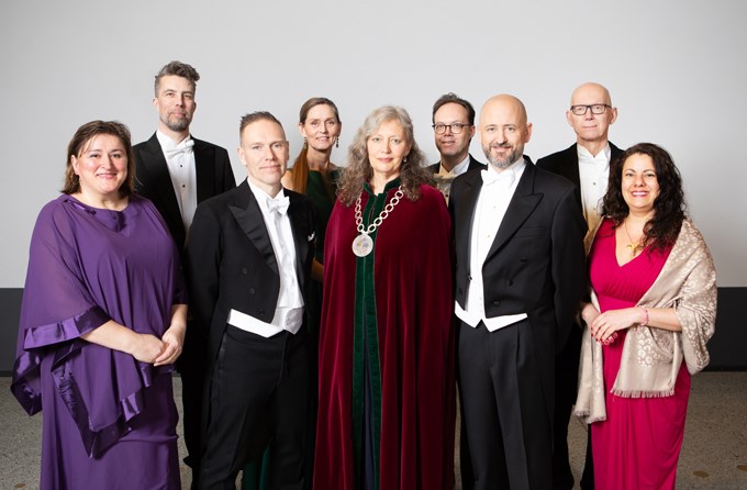 Picture of the new professors of SLU Uppsala in festive costumes, together with SLU's Vice-Chancellor Maria Knutson Wedel. 