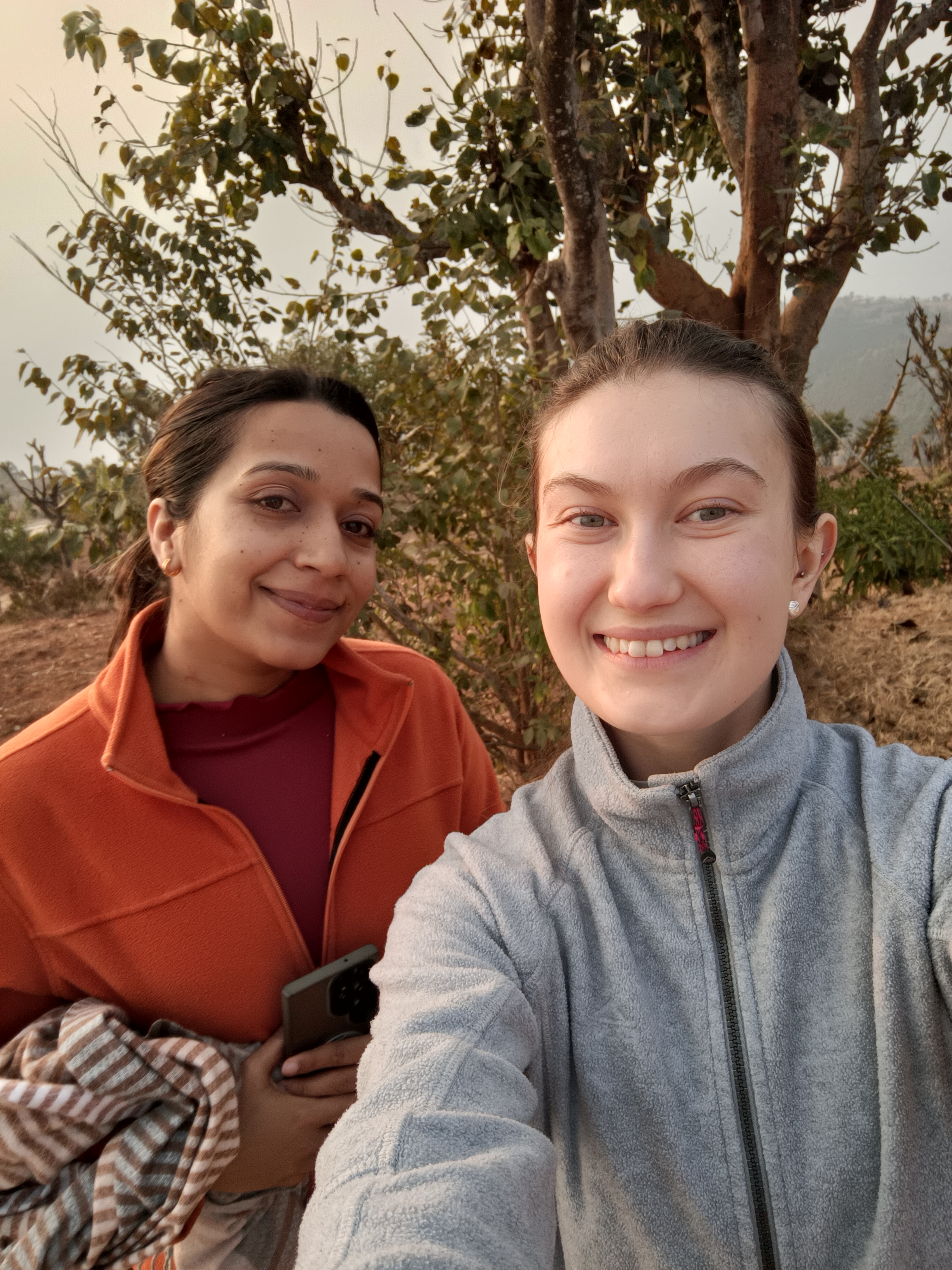 The student Tilde and her translator, looking at the camera and smiling.