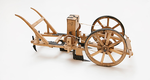 Gammal modell av såmaskin, foto.