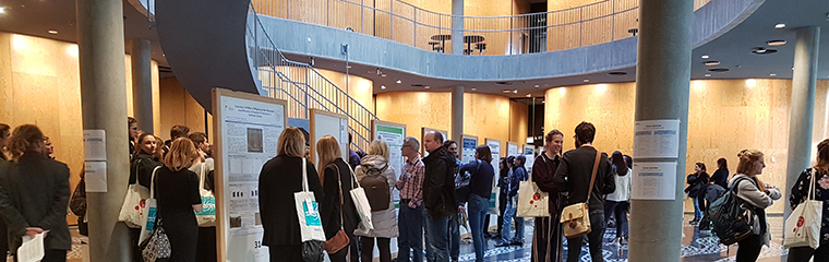 Students' work displayed at notice boards in entrance hall. Photo.