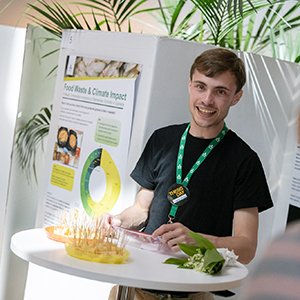 Thesis Day 2023 participant by his poster. Photographer: Johan Wahlgren