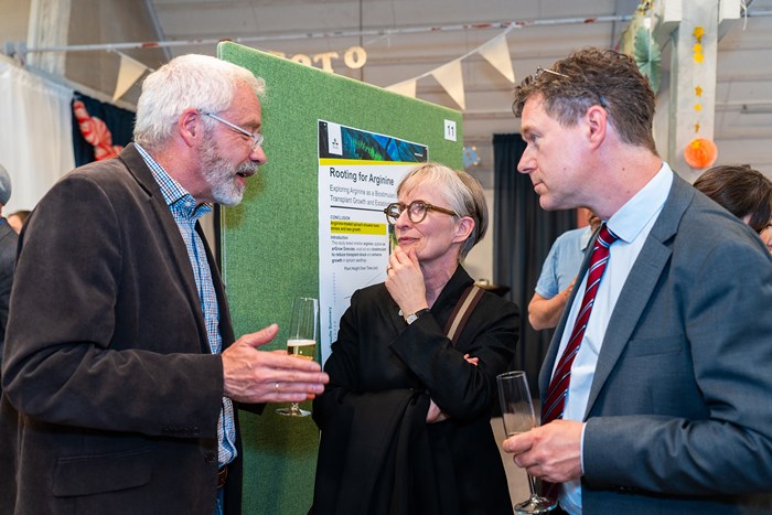 Three men in a conversation during Thesis Day in Alnarp 5 June 2025. Photographer Joe Miller.